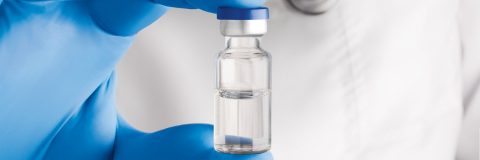 Life Sciences Vessels valor vial held by pharmaceutical researcher