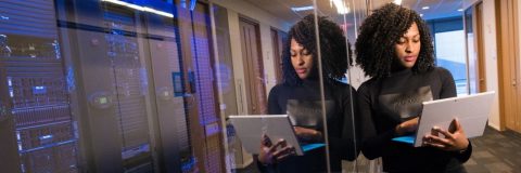 woman holding laptop