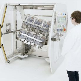 Scientist operates Corning® Automated Manipulator Platform