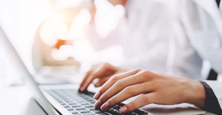 Scientist typing on computer