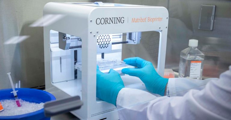 Scientist using the Corning Matribot bioprinter