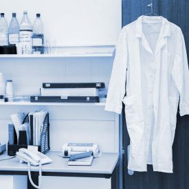 White Lab Coat Hanging in Lab