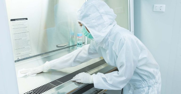 Scientist cleaning lab