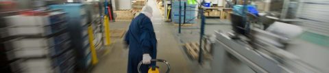 Worker moving quickly through manufacturing space