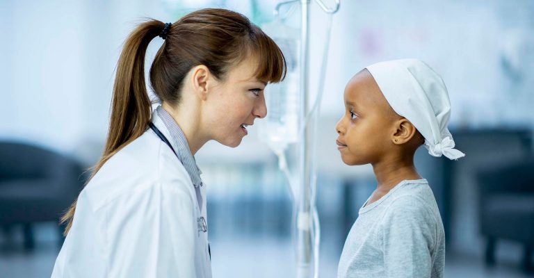 Doctor talking with a child patient