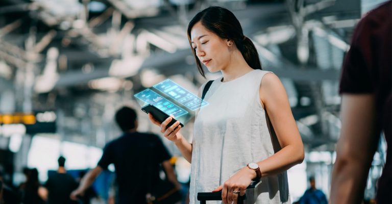 man and woman looking at iPad screen