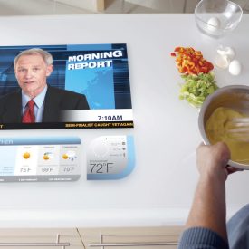 Interactive touch display embedded in kitchen counter broadcasts news show