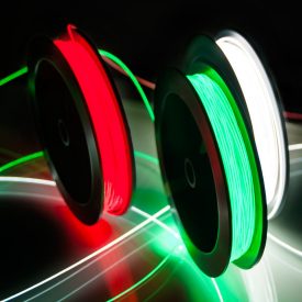 Spools of bright red, green, white Fibrance Light-Diffusing Fiber