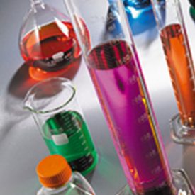 Various sizes of labware filled with brightly colored liquids