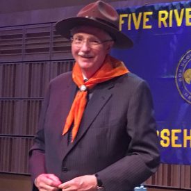 Jim Flaws dons the traditional Boy Scouts hat and scarf worn by award recipients.