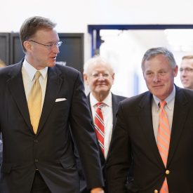 Weeks talks with U.S. Sen. Richard Burr.