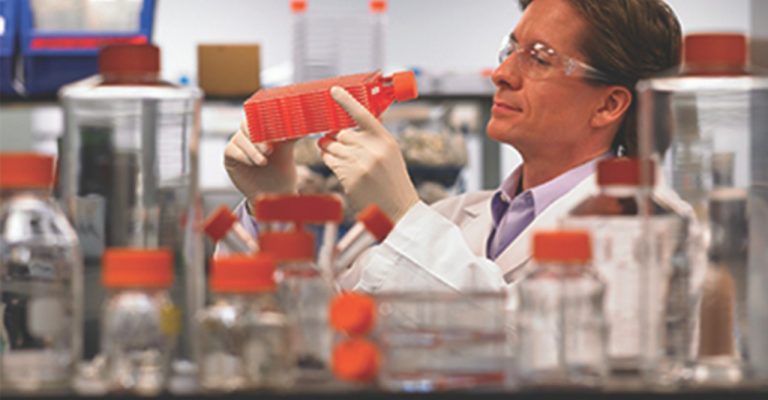 Scientist using Corning product in laboratory