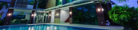 hotel at nighttime with pool