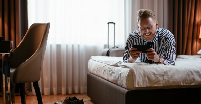 Man watching device in hotel