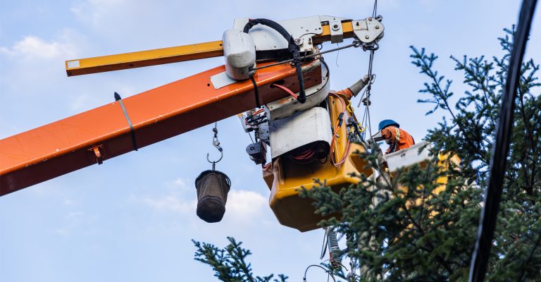 Construction workers in lift bucket