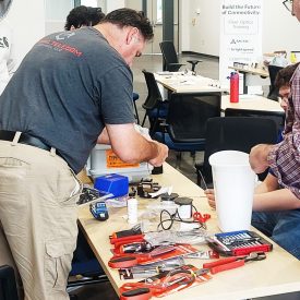 Partnering with school and nonprofits, Corning is helping train those bringing connectivity to America