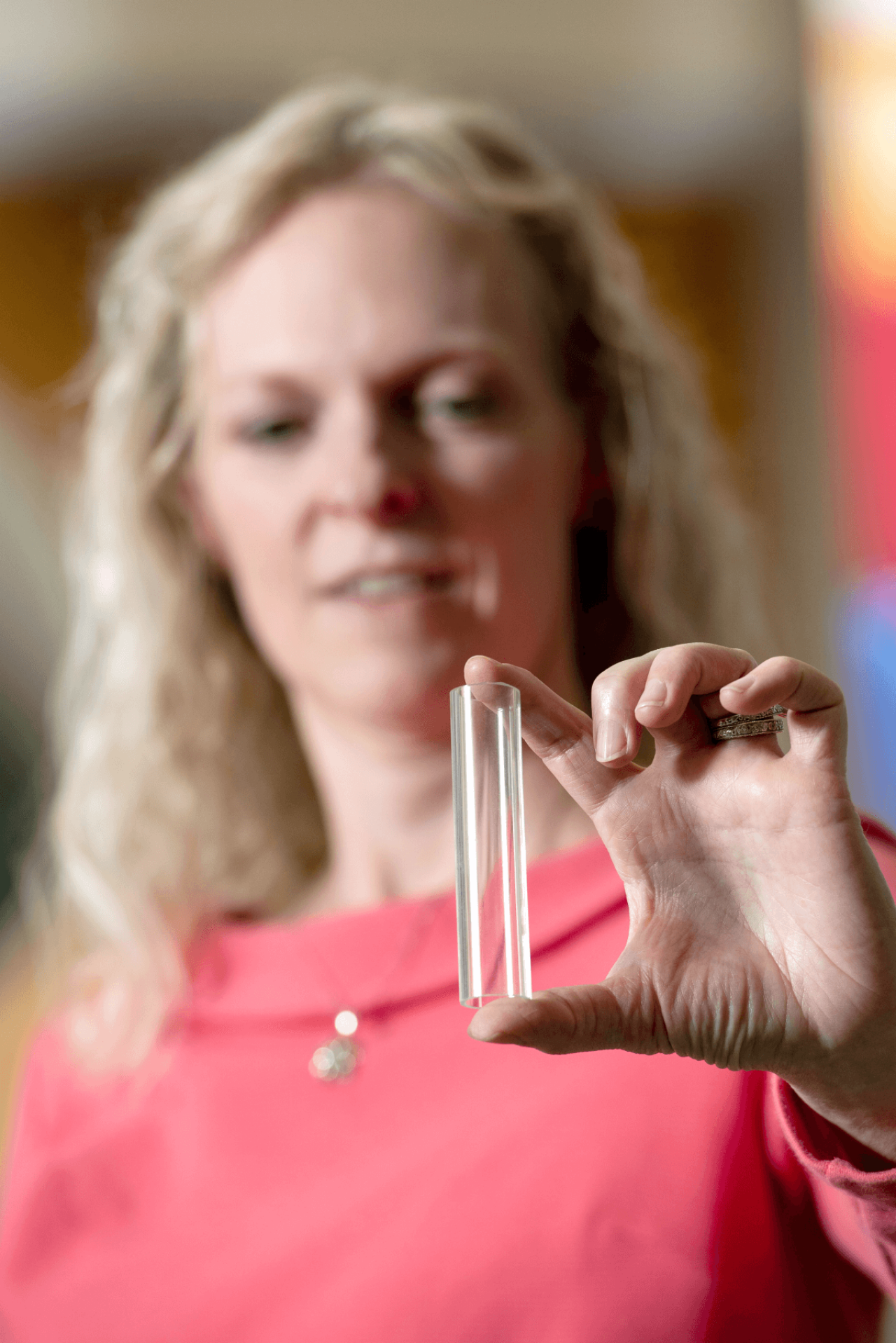 Joy Roseler displays a piece of glass tubing from a killed project. Learnings from this research and development could be resurrected at any time, thanks to extensive project documentation. 