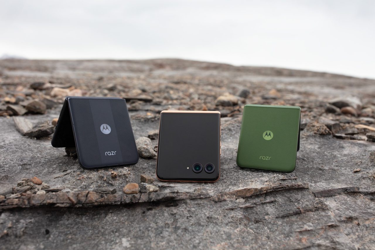 3 Motorola Razr phones in charcoal, bronze and green colors on a rock