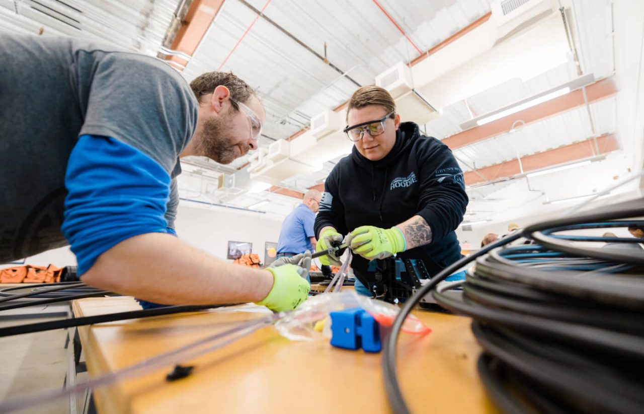 Brandi Stephenson works one-on-one with a fiber technician trainer.